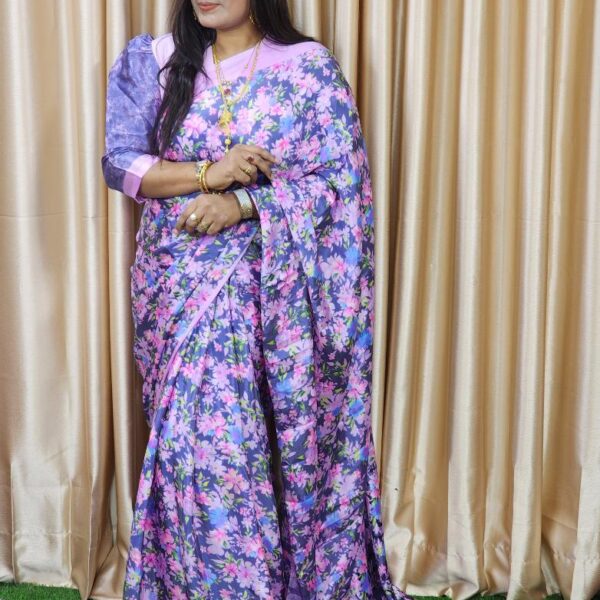 Premium digital-print silk saree featuring vibrant motifs and a matching running blouse piece. Lightweight, smooth drape — perfect for festive and formal wear.